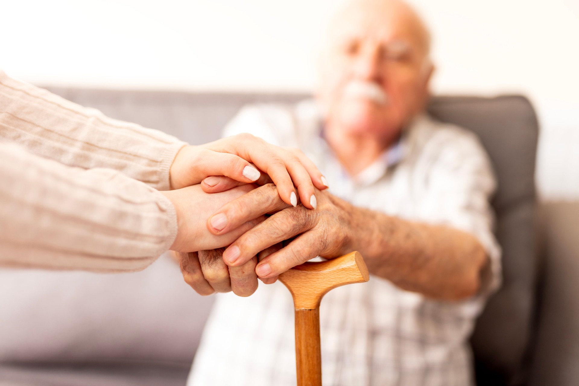 Home caregiver showing support for elderly patient